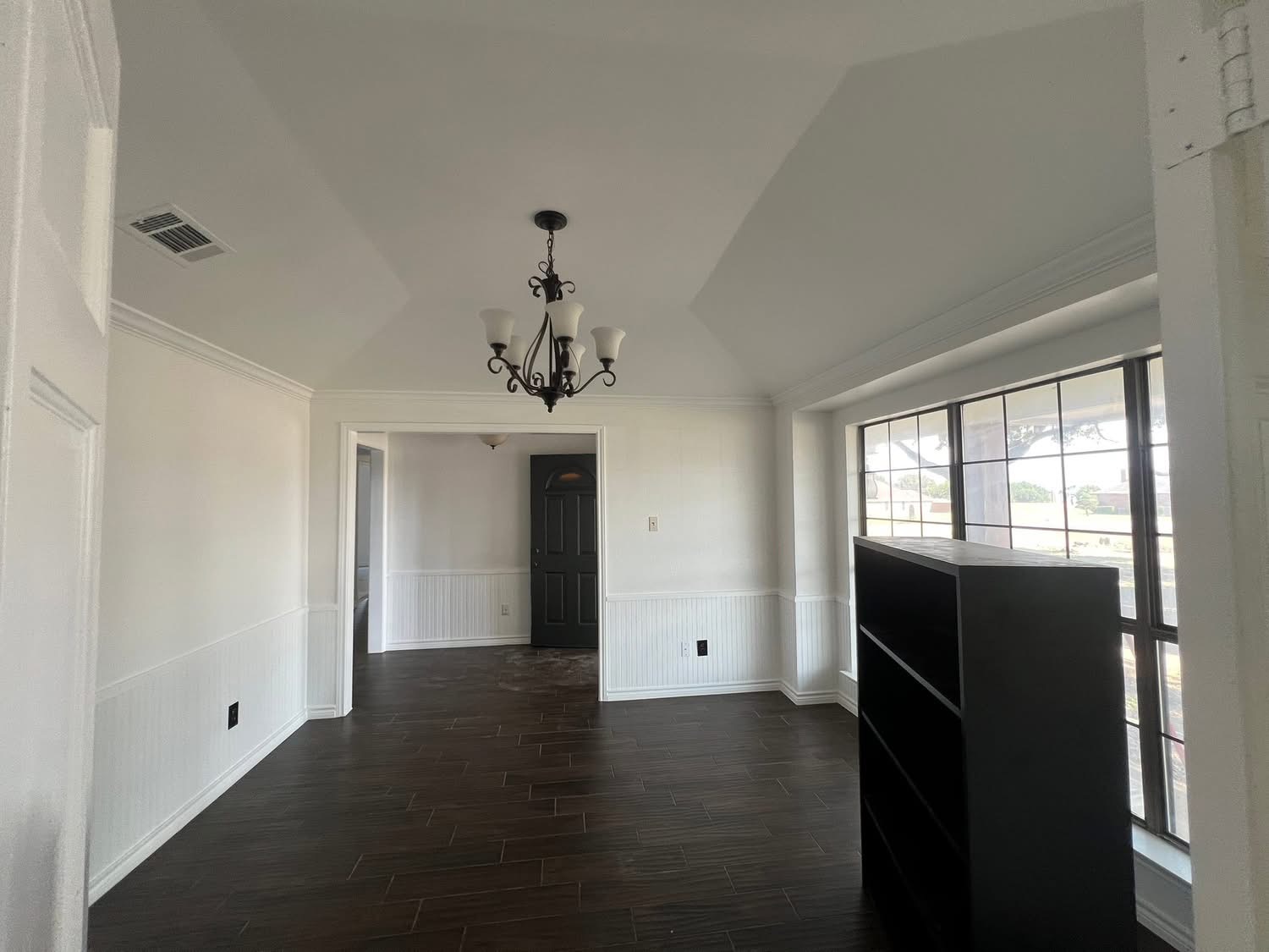 Interior painting — dining room with crisp white wainscoting
