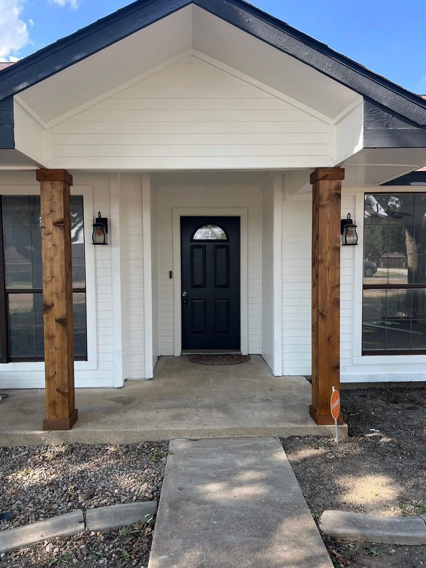 Exterior painting — white siding with black front door and cedar columns