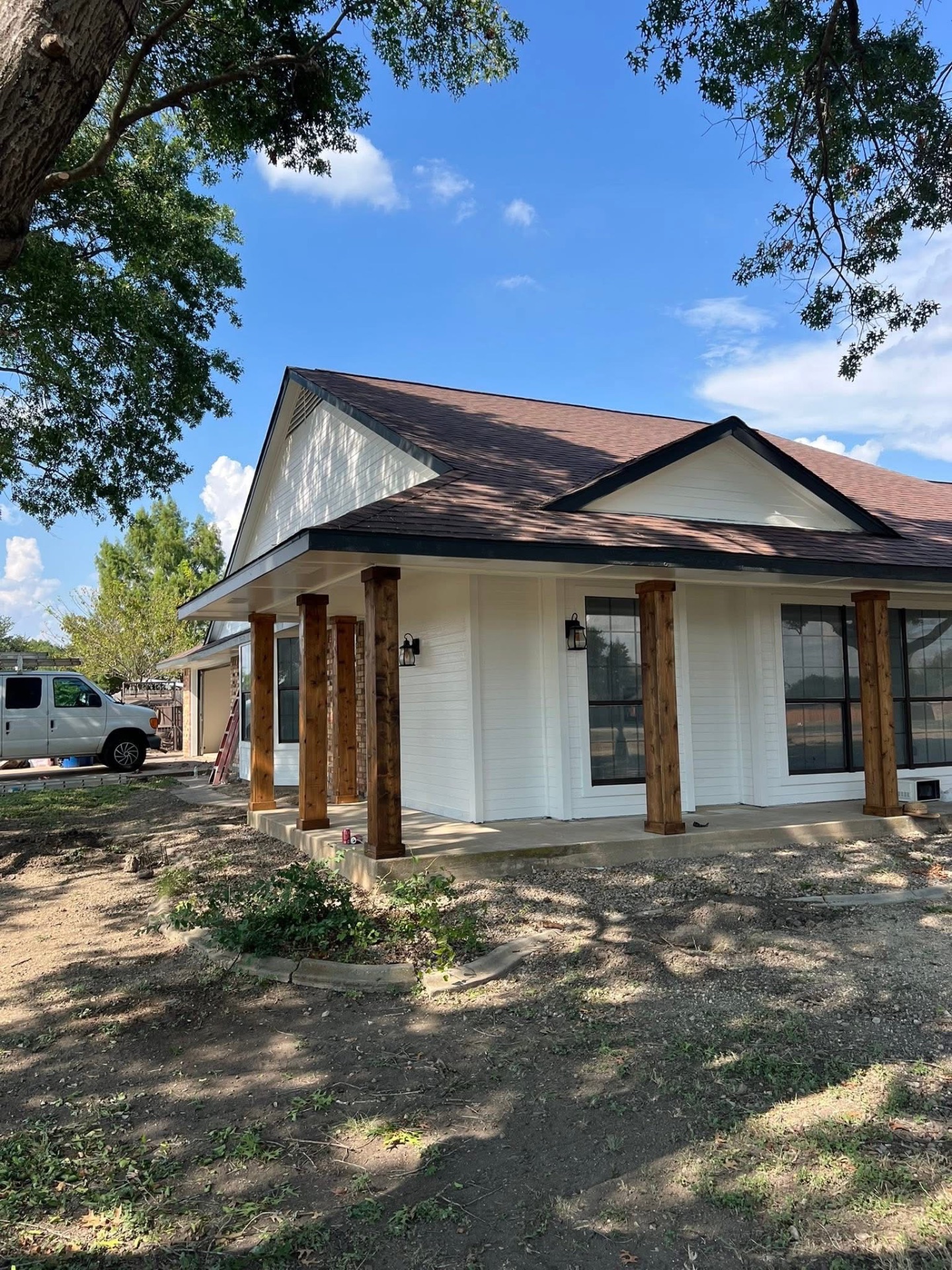 Exterior painting — covered porch with stained cedar columns